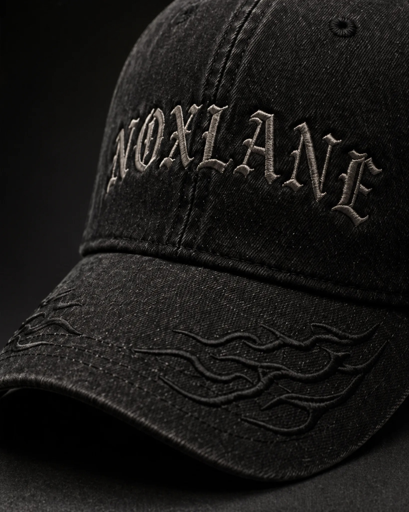 VOID LANE CAP detail view of gothic embroidery and washed black cotton twill